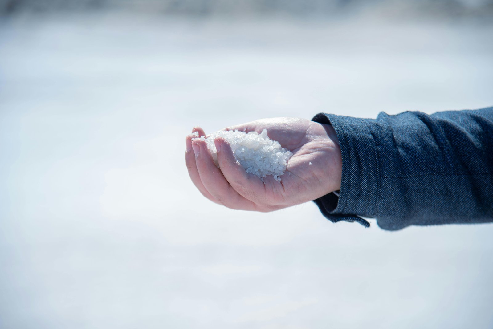 Puresol natural alkaline salt held in hand, harvested from Sambhar Lake
