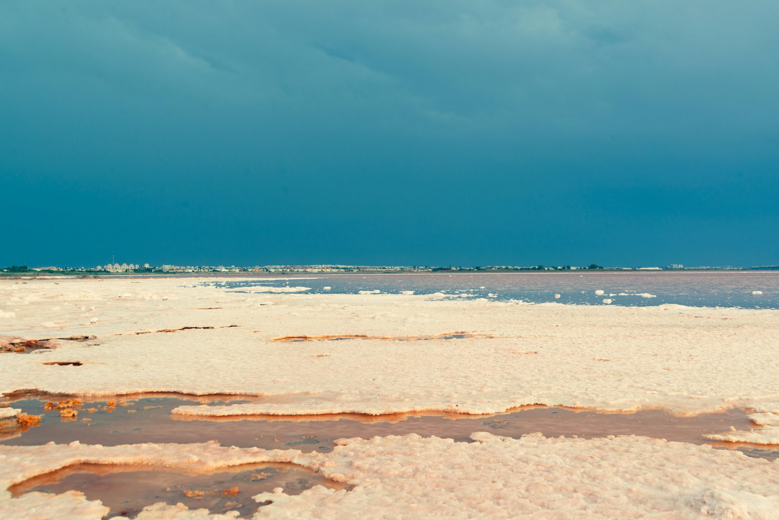 Panoramic view of Sambhar Lake's vast pink brine beds stretching to the horizon