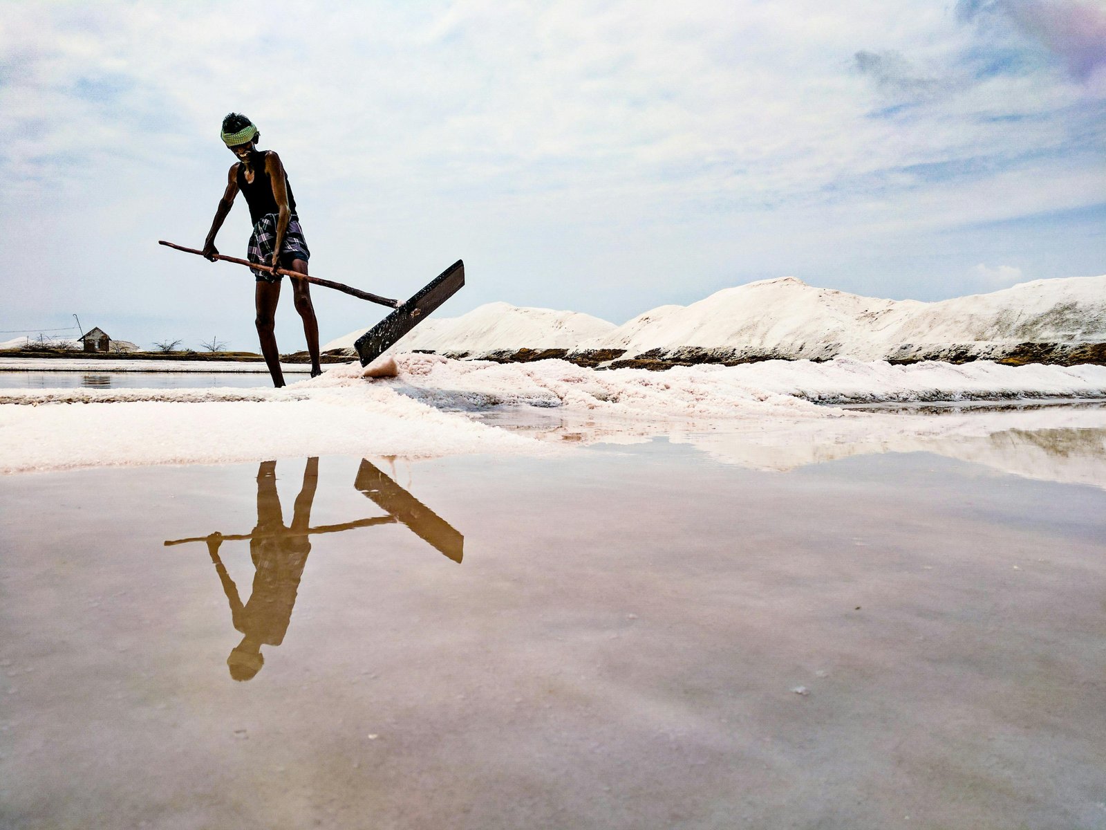 Mineral-rich brine being channelled into shallow salt pans